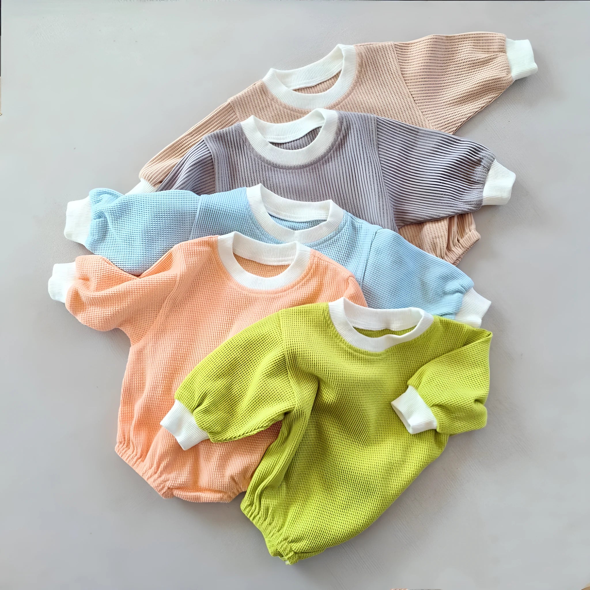 Baby waffle cotton loose triangle jumpsuit bodysuit in coral with hidden hook closure long sleeves