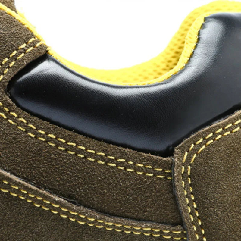 Bronze coloured low-cut cow suede leather safety shoes with a steel toe cap on a patterned non-slip sole.