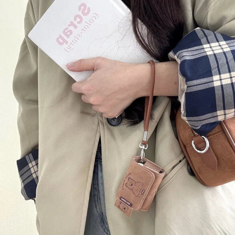 Brown leather-pattern AirPods protective cover with West Highland dog cartoon design and frosted finish