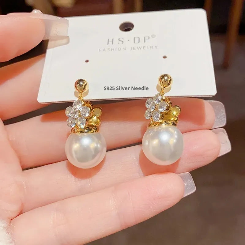 Female Korean style double-sided flower pearl earrings in gold plated copper with clip-on design