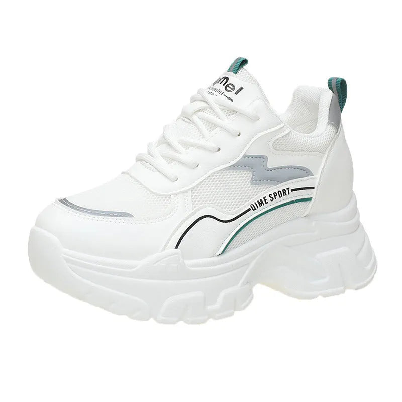 Women's white breathable dad shoes with cross strap and lace-up front on a rubber sole.