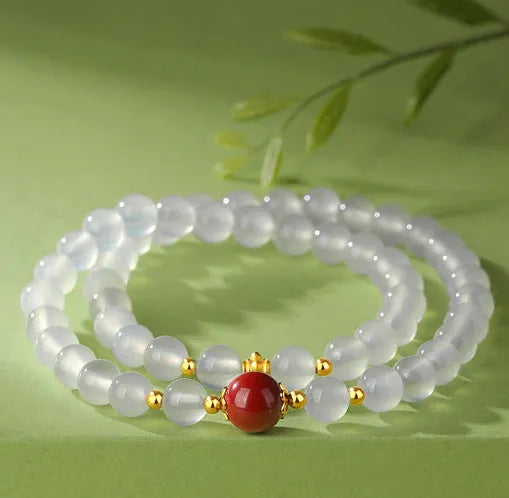 Women's double layer bracelet with white agate geometric beads and Jequirity bean cinnabar accents
