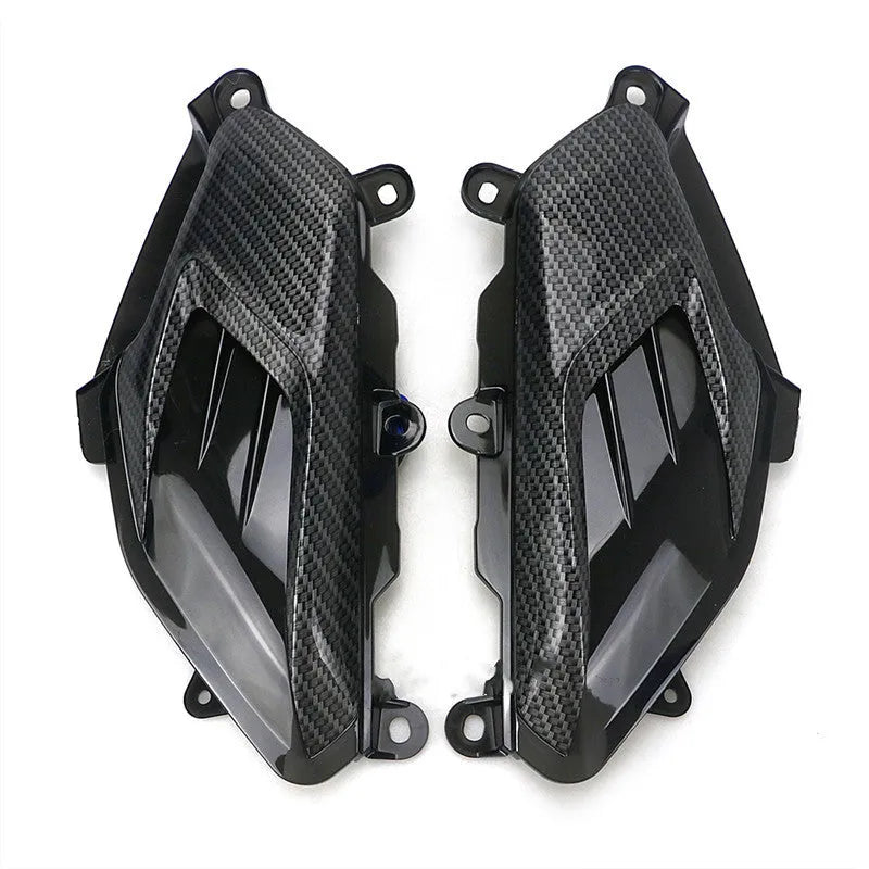 Pair of Yamaha NMAX aftermarket LED side lamps with carbon fibre decal on ABS shell.