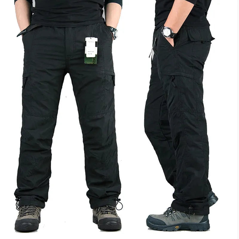 Men's wool-lined cotton velvet overalls in army green, shown in a loose straight-leg fit.