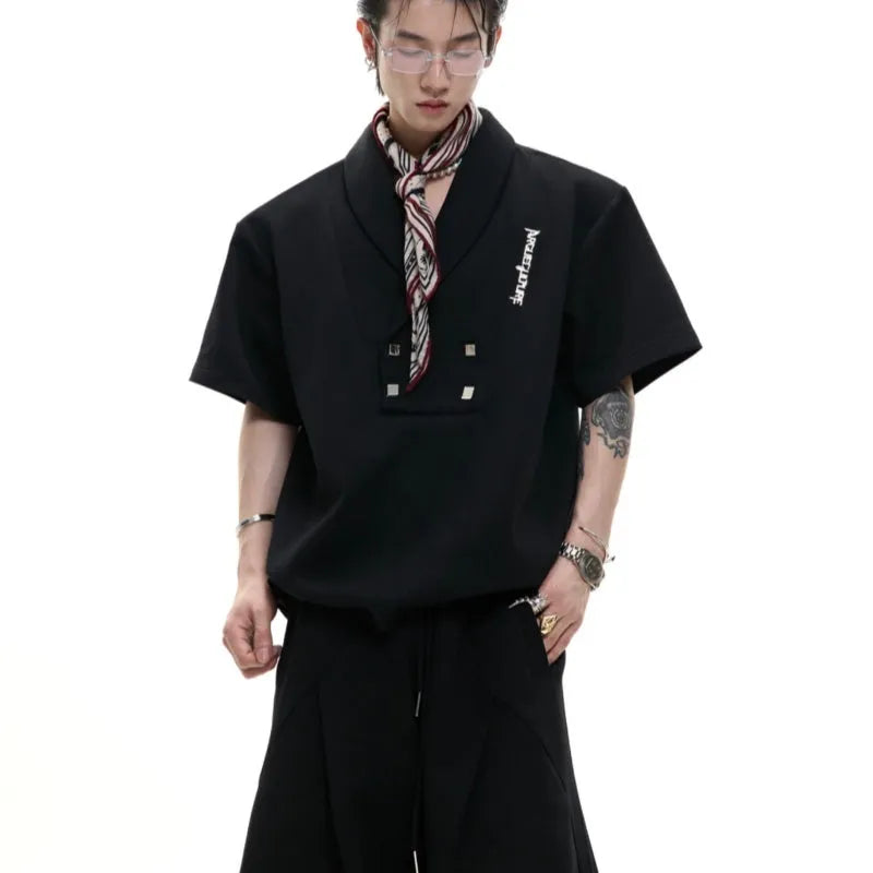 Men's dark grey cotton sports suit with padded shoulder shirt and shorts featuring metal embellishments.