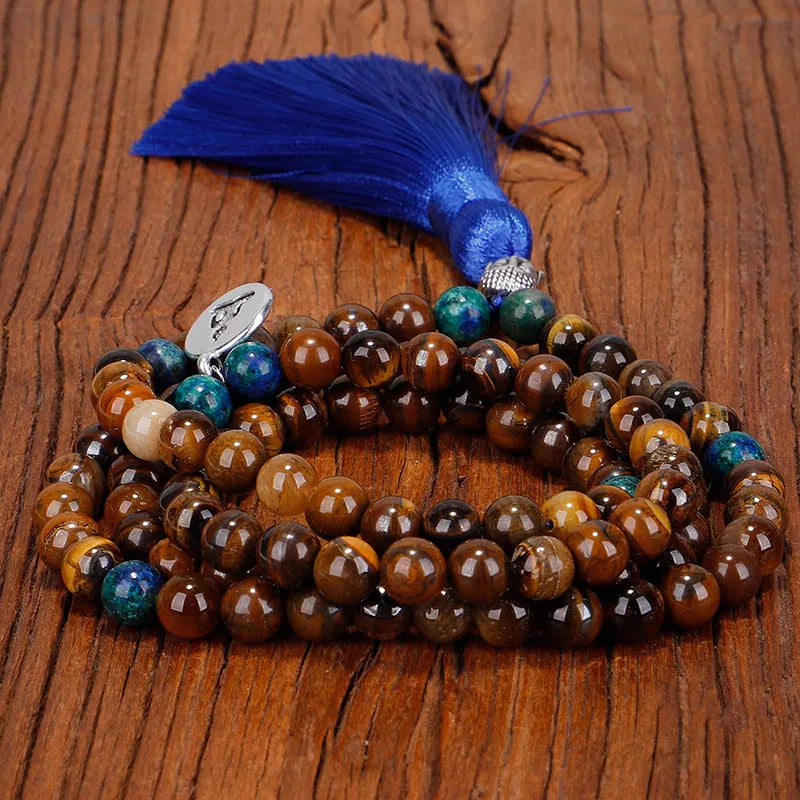 Handmade tiger eye stone bead necklace with Buddha head pendant and tassel on women model