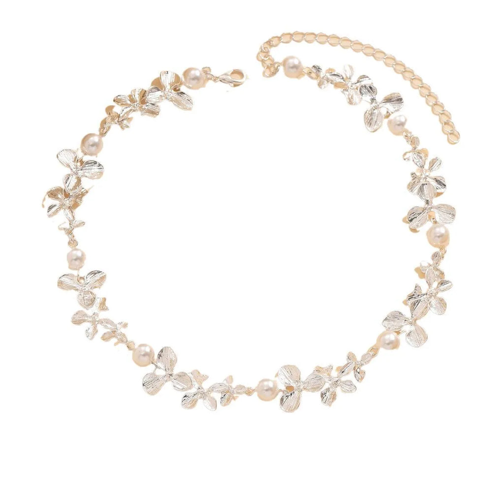 Bright silver alloy flower pearl curved needle clavicle necklace on neutral background