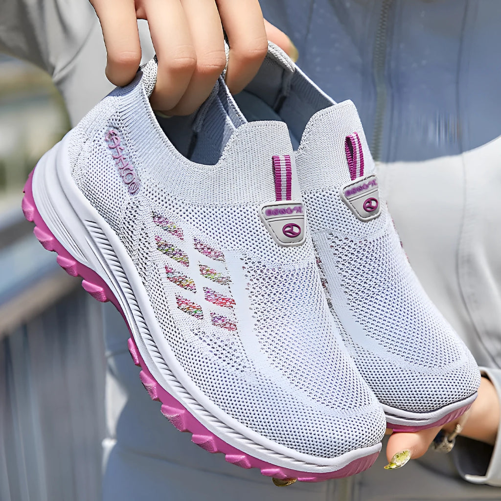 Women's flyknit slip-on casual shoes with mesh upper and PVC sole, shown in black, red, grey, and purple.