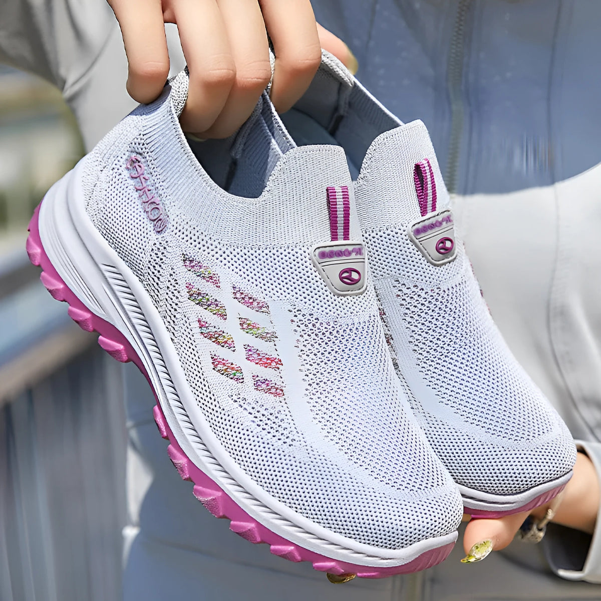Women's flyknit slip-on casual shoes with mesh upper and PVC sole, shown in black, red, grey, and purple.
