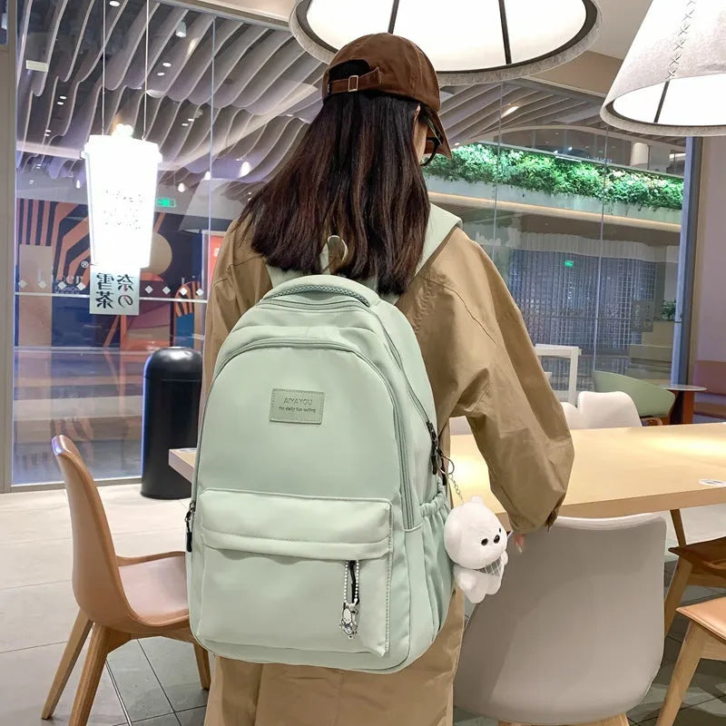 Large capacity nylon backpack in beige with solid colour street style and anti-theft design