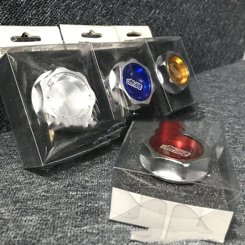 Aluminium alloy oil filter cap for Honda vehicles in assorted colours on a dark background.
