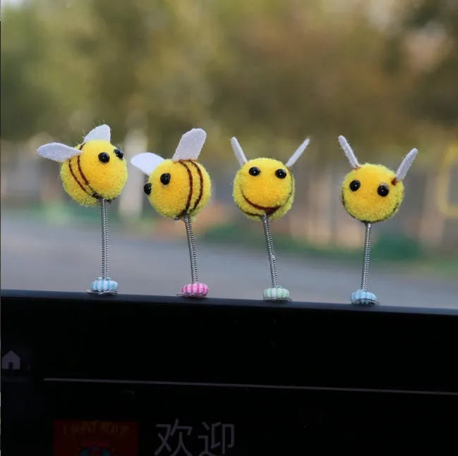 Small fur ball bee car decoration measuring 3cm square with cartoon design