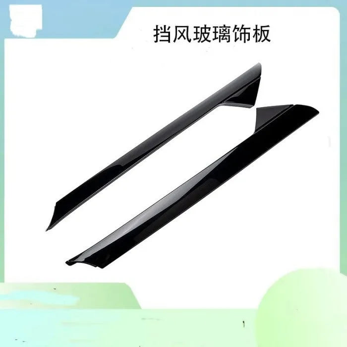 Black front windshield trim panel for Ford vehicles, replacement part codes BB5Z-7803144-AA and BB5Z-7803145-AA.