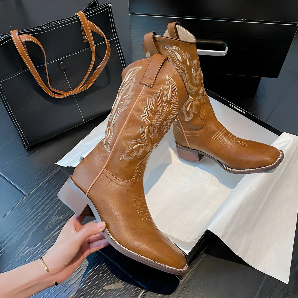 Brown women's embroidered Martin boots with mid-calf length, leather lining, and waterproof platform