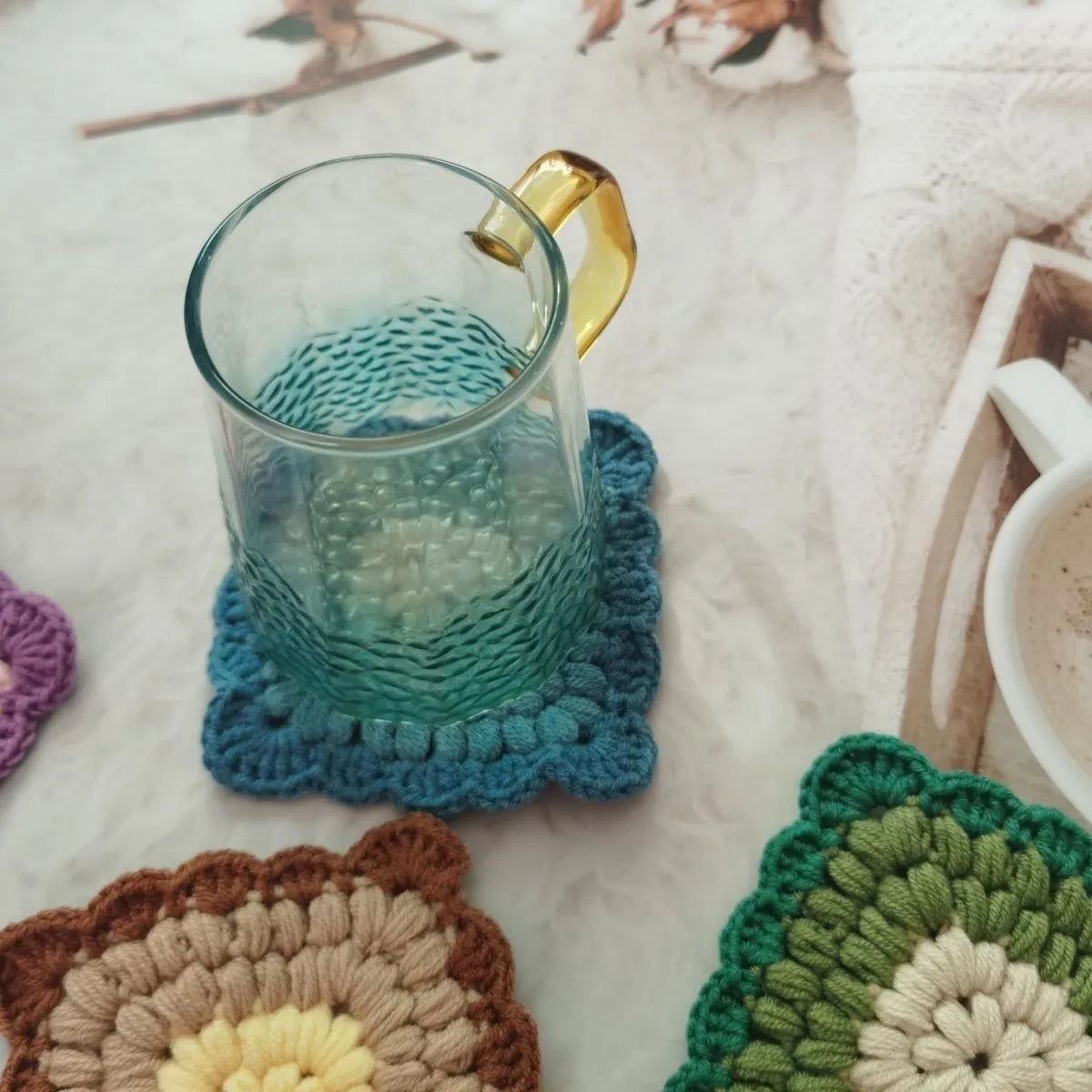 Crocheted wool insulated cup placemat with grandmother lattice pattern in choice of colours