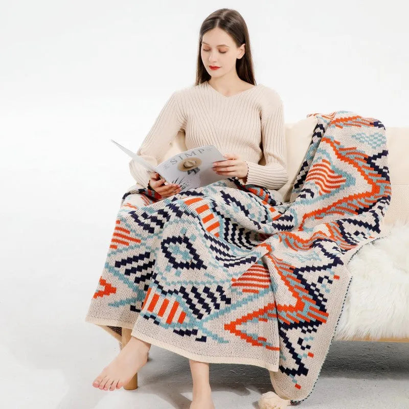 Bohemian-style acrylic knit sofa blanket with tassels in a geometric pattern