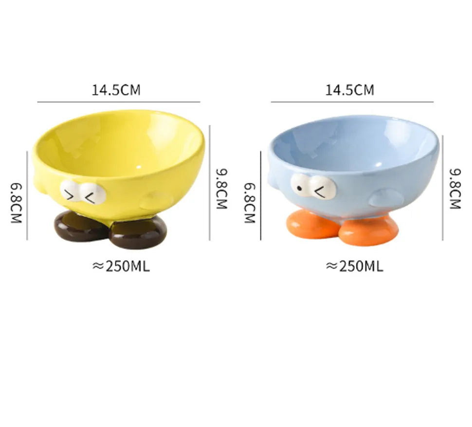 Blue ceramic pet bowl with tall, angled sides and a cute face design for cat or small dog feeding.