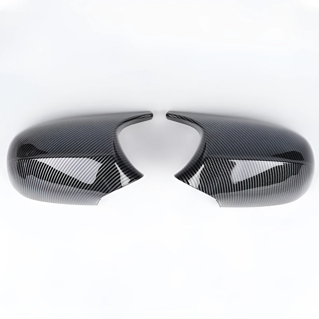 A pair of black ABS plastic rearview mirror shells for a BMW 3 Series E90 car.