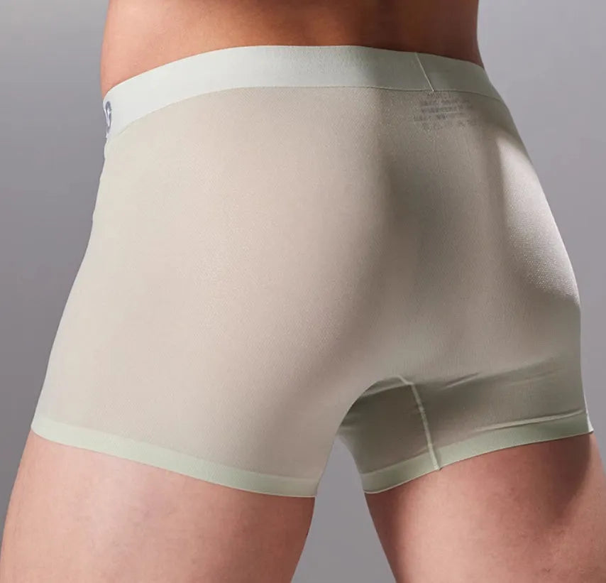 Man wearing seamless grey fitness shorts with antibacterial finish, sizes up to 3XL.