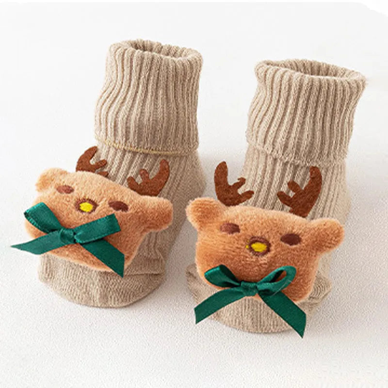 Cotton baby floor socks in assorted colours and prints like blue bow and pink stars on a size chart.