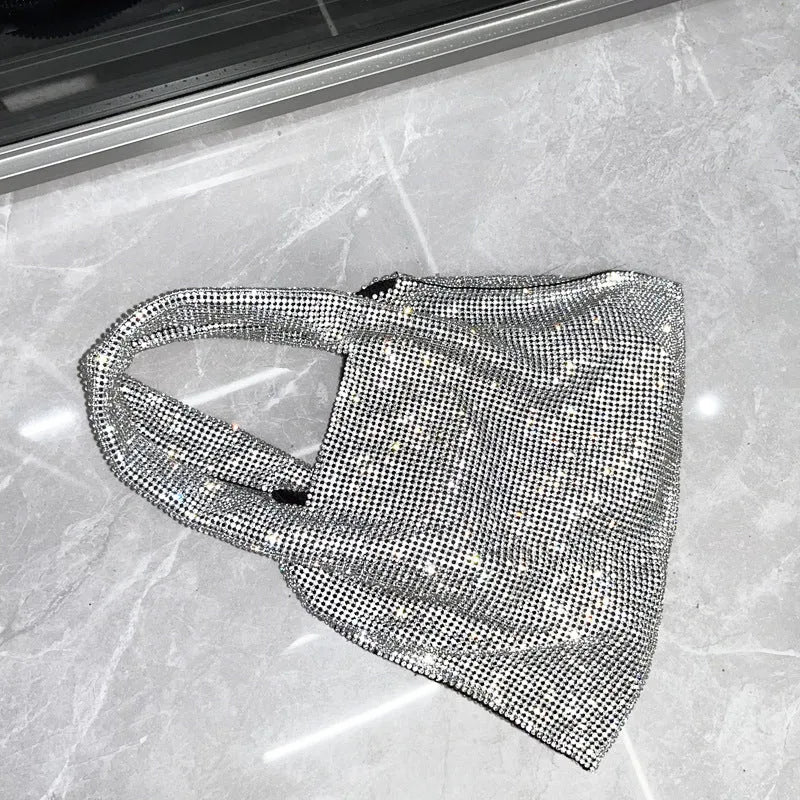 Silver cotton thread evening handbag with shiny rhinestone detailing and open outer pocket