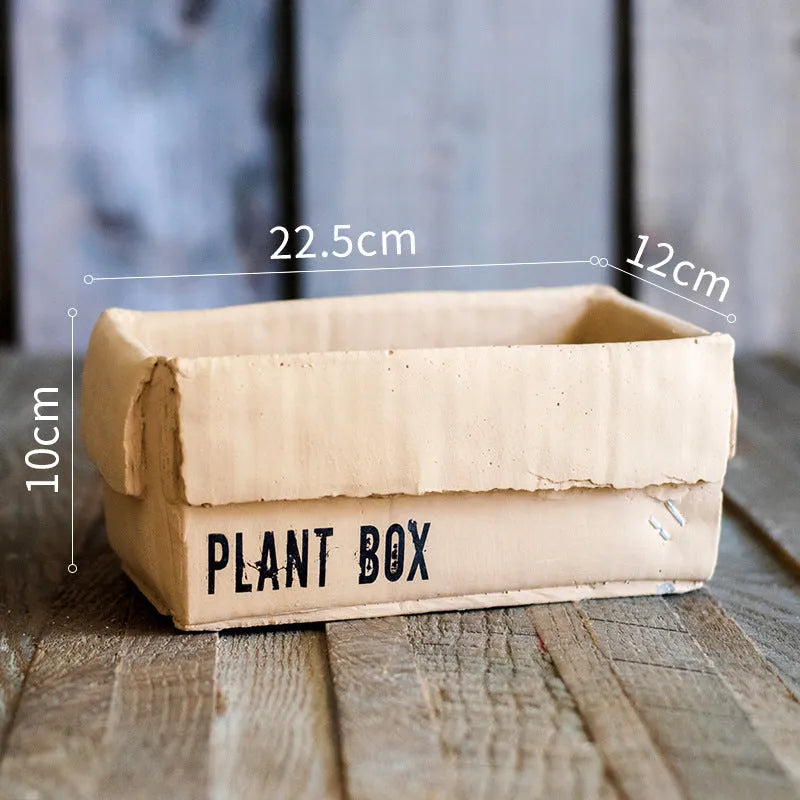 Cement brown paper box style flowerpot with drainage holes for indoor plants