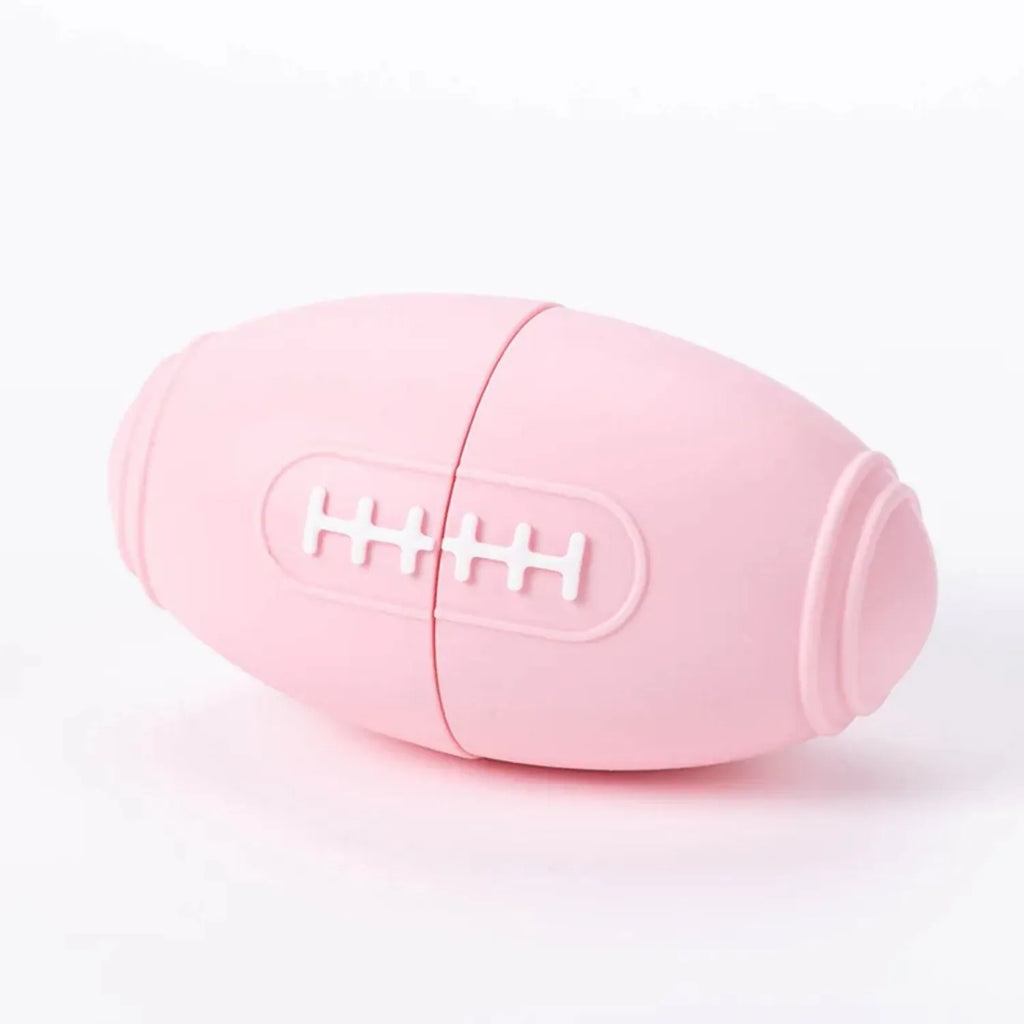 Blue silicone rugby ball shaped dog chew toy for boredom relief and interactive feeding.