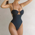 Black one-piece swimsuit bikini for women on a white background.