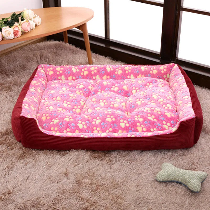 Beige sofa-style dog bed with plush fabric and raised bolsters for small dogs