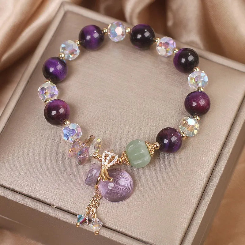 Women's purple tigereye crystal bracelet with money bag pendant and rhinestone decoration in forest style design