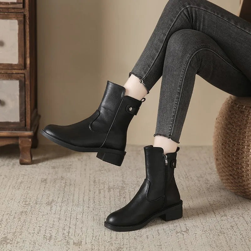 Black women's ankle boots with side zip and low round toe on rubber sole