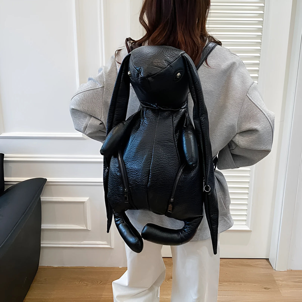 Black PU women's bucket backpack with double straps, patchwork stitching and internal phone, ID and hidden pockets