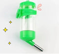 Green plastic ball kettle water feeder for small pets with a leak-proof drinking tube.