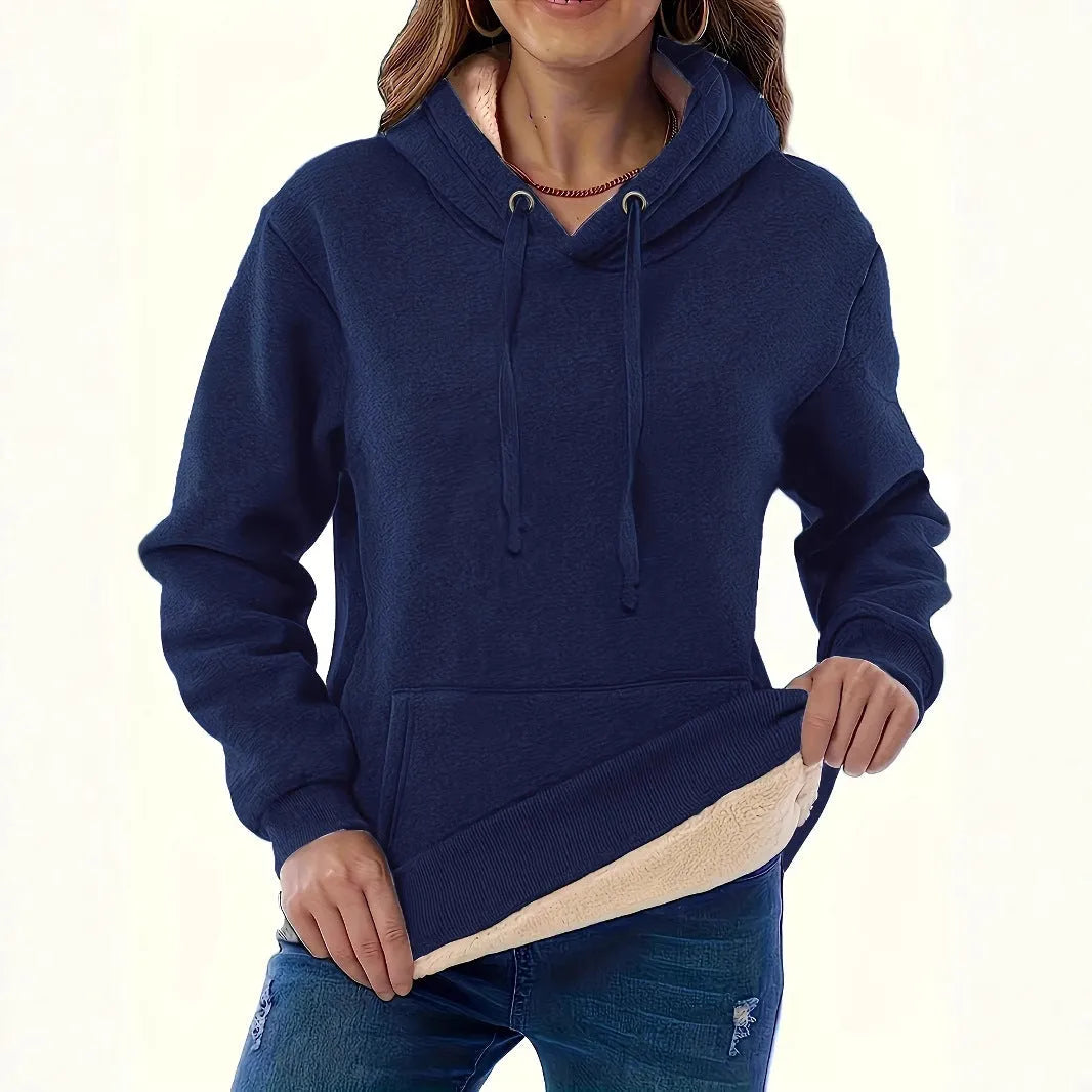 Women's loose fit hooded sweater in thick polyester fabric available in multiple colours.