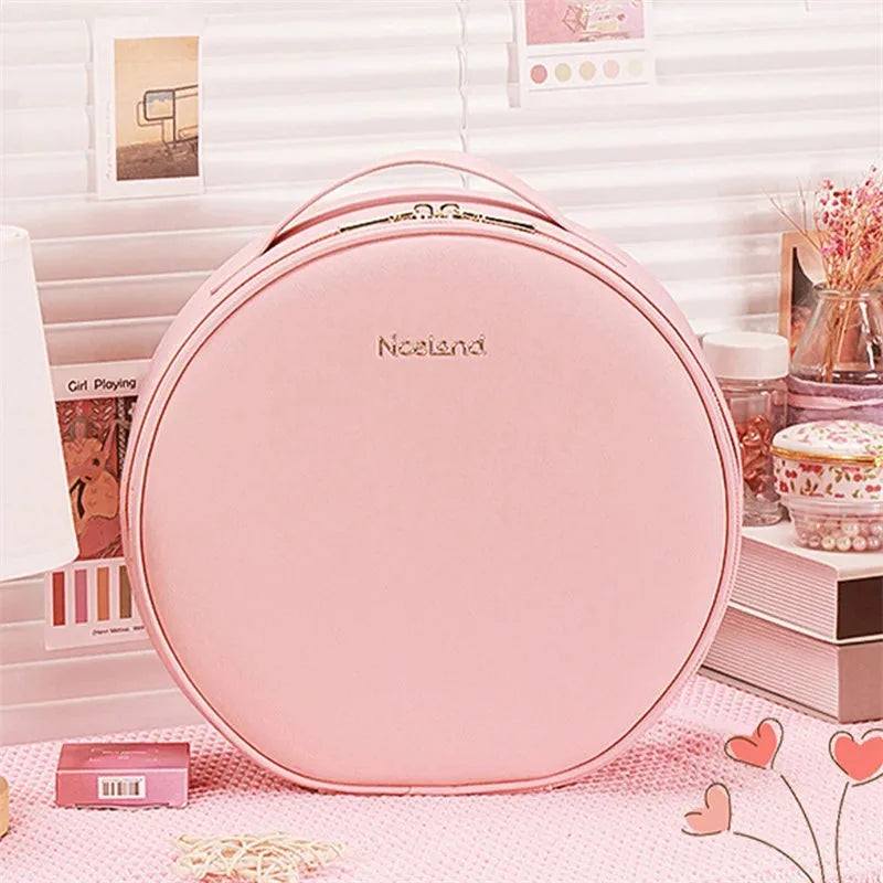 Round Cherry Blossom Pink LED makeup bag with mirror open, showing internal compartments and adjustable lights.