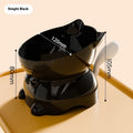 Slanted stainless steel cat bowl in blue with weighted silicone non-slip base on a wooden floor.