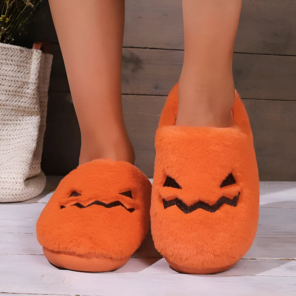 Orange women's Halloween pumpkin slippers with plush lining and a non-slip PVC sole