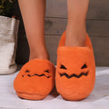Orange women's Halloween pumpkin slippers with plush lining and a non-slip PVC sole
