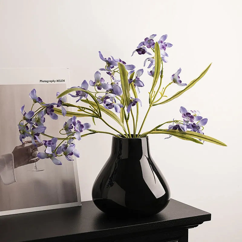 Black ceramic round belly vase with glass surface and coloured glaze decoration
