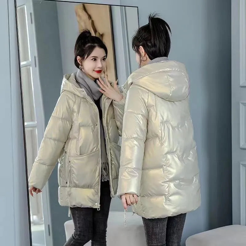 Women's loose-fitting long sleeve hooded jacket in black, shown on a hanger.