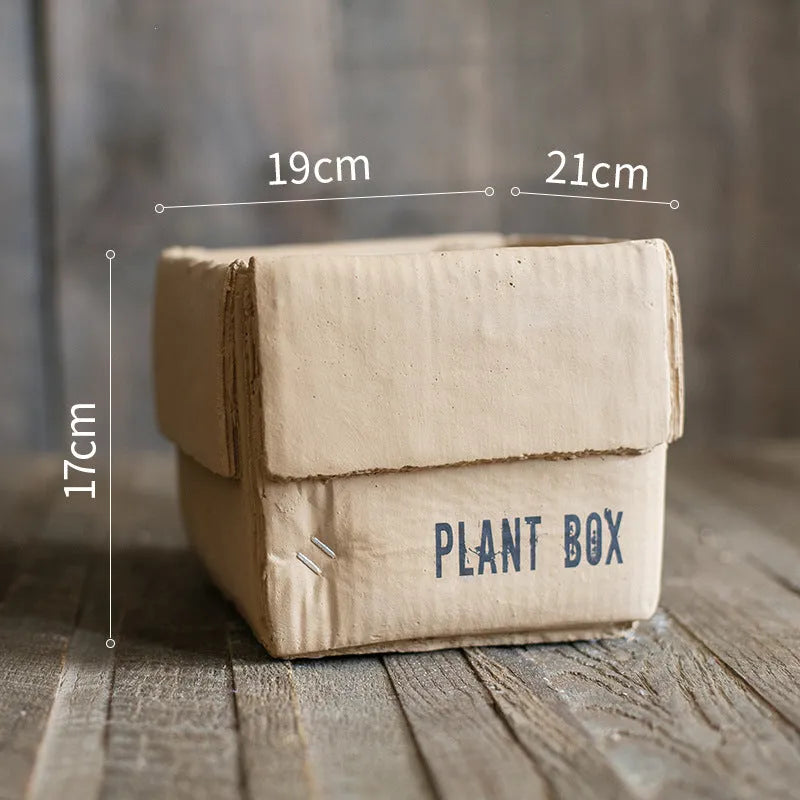 Cement brown paper box style flowerpot with drainage holes for indoor plants