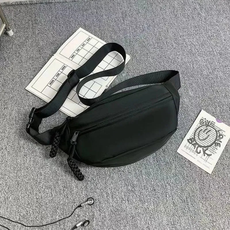Men's black polyester chest bag shown as a crossbody bag with 35cm width