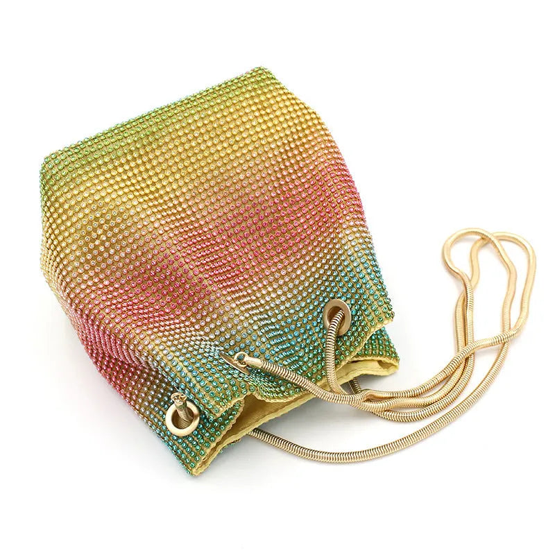 Soft rainbow-coloured rhinestone bucket bag with a flexible structure and classic shape.