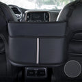Black leather car seat storage bag with a carbon fibre pattern, shown in a vehicle seat gap.