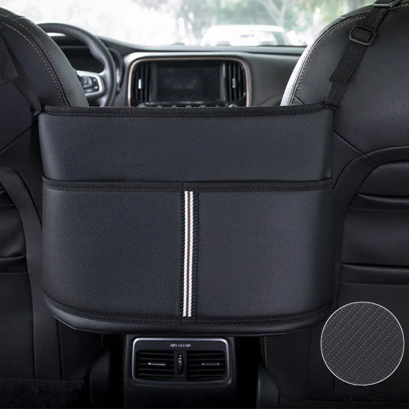 Black leather car seat storage bag with a carbon fibre pattern, shown in a vehicle seat gap.
