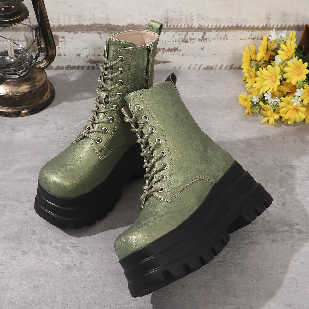 Women's black retro platform Martin boots with chunky heel and side zipper on a three-layer sole