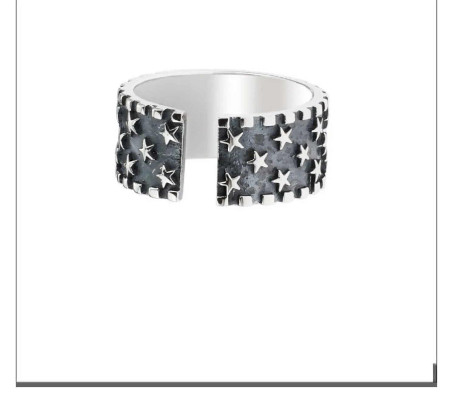 Adjustable sterling silver ring showing multiple five-pointed star geometric pattern on band