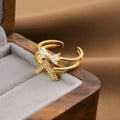 Gold geometric openwork women's ring made from electroplated copper, showing intricate cut-out details.