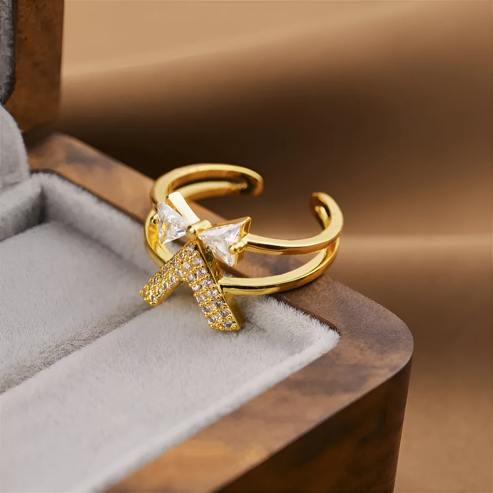 Gold geometric openwork women's ring made from electroplated copper, showing intricate cut-out details.