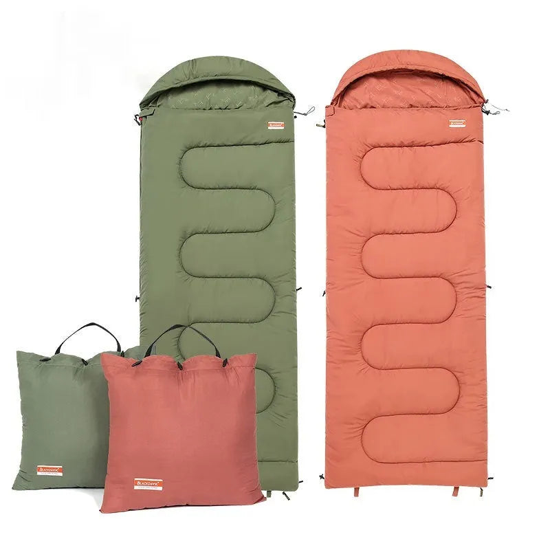 Olive green cotton sleeping bag quilt laid out flat for camping.